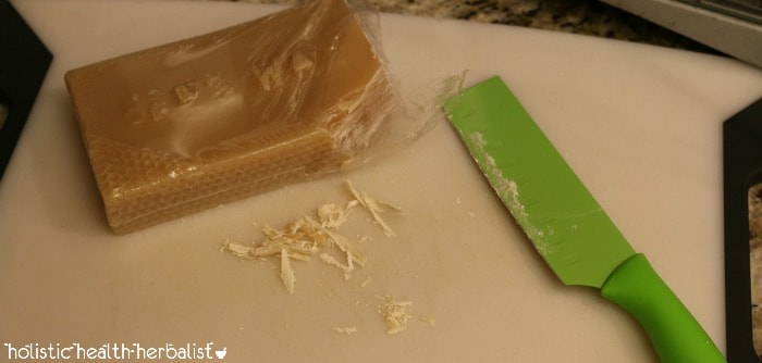 cutting the beeswax- how to make lip balm