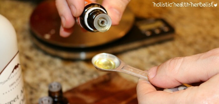 measuring the essential oils- how to make lip balm